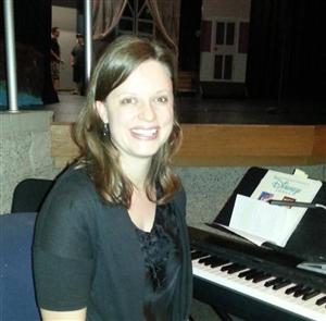 Mrs. Rutherford at the keyboard 